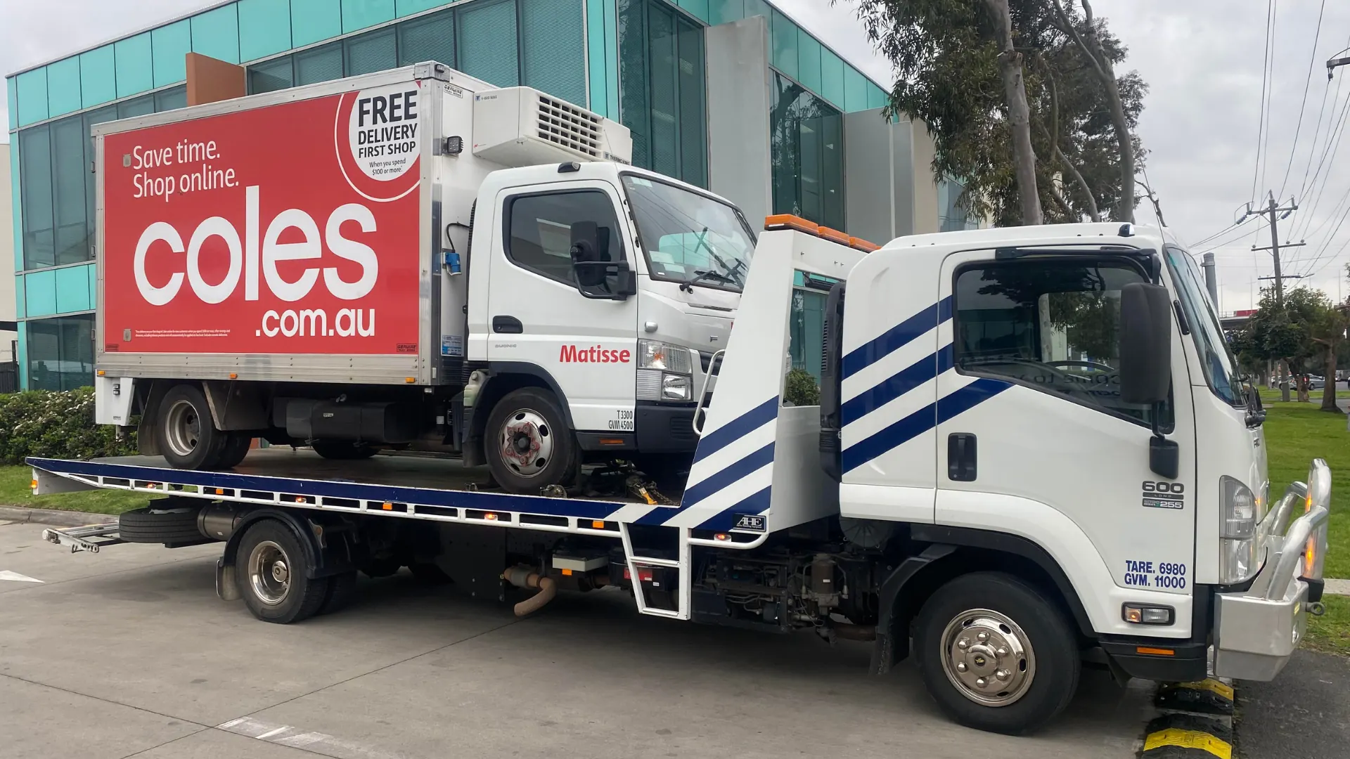 Coles delivery truck loaded on the All Over Towing tilt tray in Melbourne